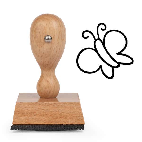 Springtime Butterfly Craft Stamp standing upright beside its black stamped butterfly image