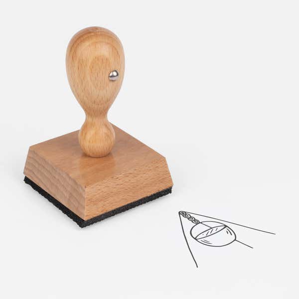 Camp Pot Craft Stamp at an angle with its wooden handle and block
