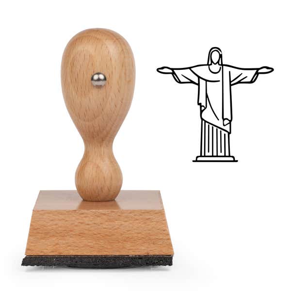 Christ the Redeemer Craft Stamp standing upright beside its black stamped Christ the Redeemer image