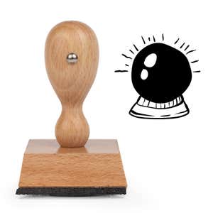 Mystic Crystal Ball Craft Stamp standing upright beside its black stamped crystal ball image