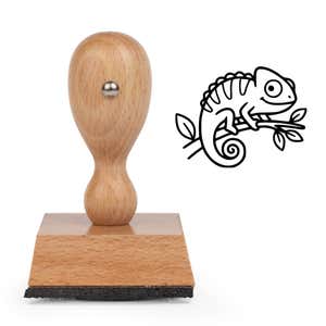 Cute Chameleon Craft Stamp standing upright beside its black stamped cartoon chameleon image