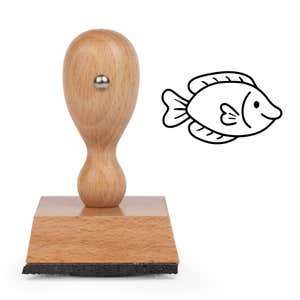 Cute Fish Craft Stamp standing upright beside its black stamped smiling cartoon fish image