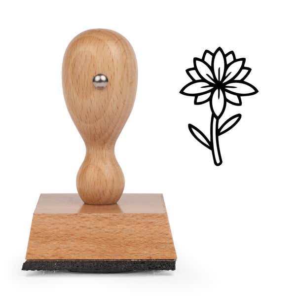 Starburst Petal Flower Craft Stamp standing upright beside its black stamped starburst petal flower image