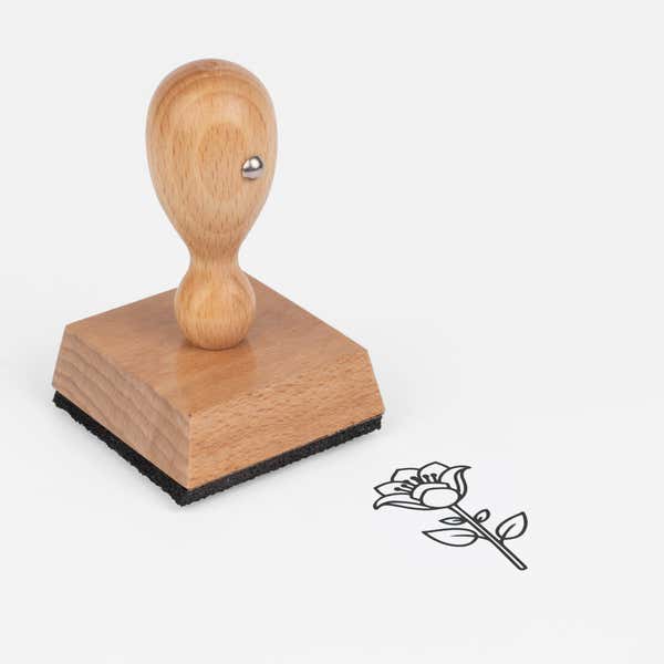 Flared Petal Flower Craft Stamp at an angle with its wooden handle and block