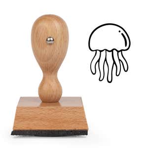Cute Jellyfish Craft Stamp standing upright beside its black stamped cartoon jellyfish image