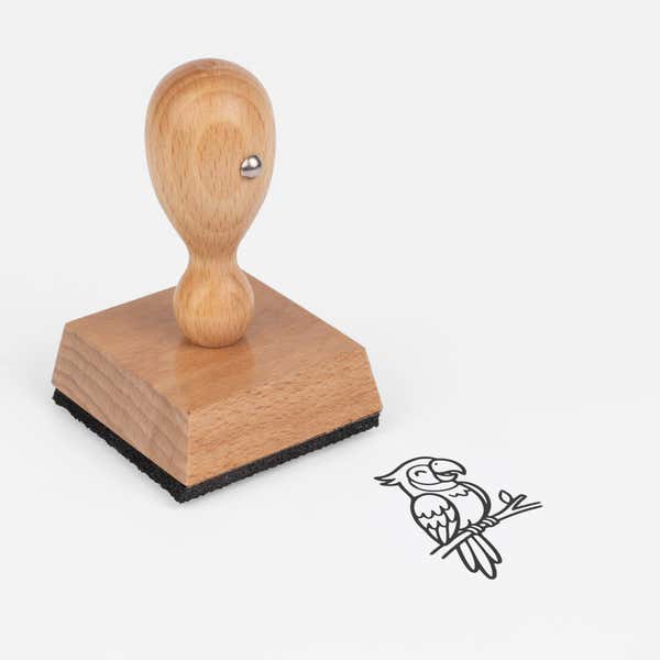 Cute Parrot Craft Stamp at an angle with its wooden handle and block