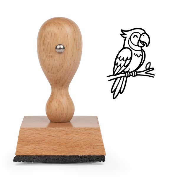 Cute Parrot Craft Stamp standing upright beside its black stamped cartoon parrot image