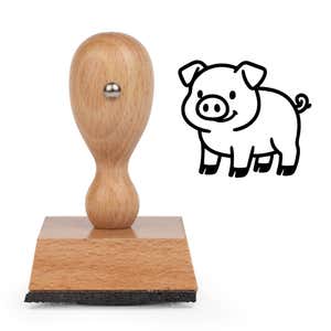 Cute Pig Craft Stamp standing upright beside its black stamped cartoon pig image
