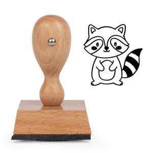 Cute Raccoon Craft Stamp standing upright beside its black stamped cartoon raccoon image