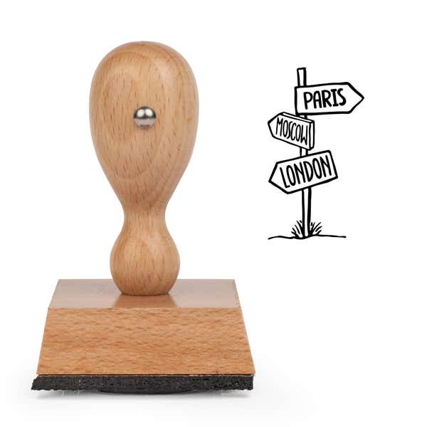 Destination Sign Craft Stamp standing upright beside its black stamped destination sign image