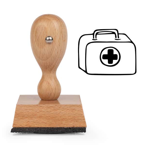 First Aid Kit Craft Stamp standing upright beside its black stamped first aid kit image