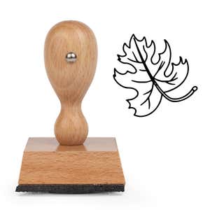 Curly Stem Lobed Leaf Craft Stamp standing upright beside its black stamped curly stem lobed leaf image
