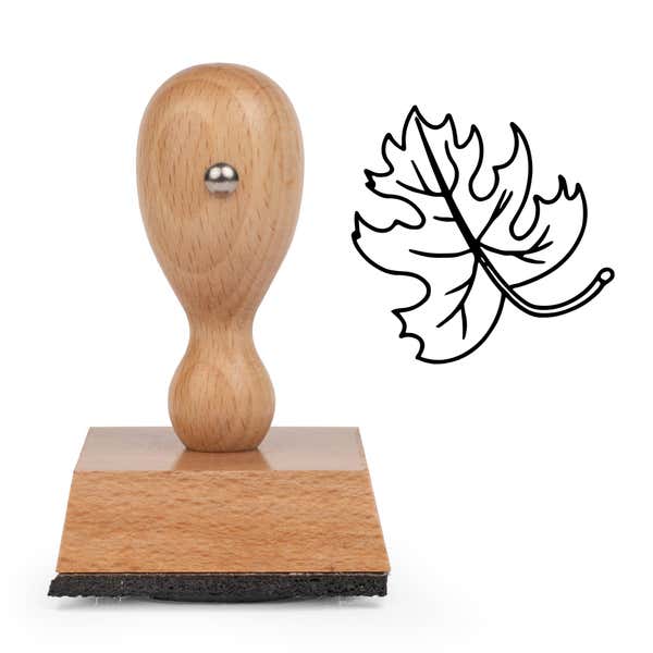 Curly Stem Lobed Leaf Craft Stamp standing upright beside its black stamped curly stem lobed leaf image