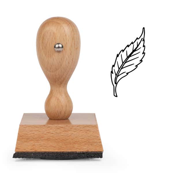 Curved Serrated Leaf Craft Stamp standing upright beside its black stamped curved serrated leaf image