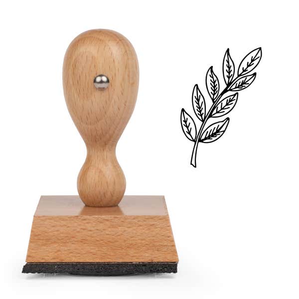 Leafy Branch Sprig Craft Stamp standing upright beside its black stamped leafy branch sprig image
