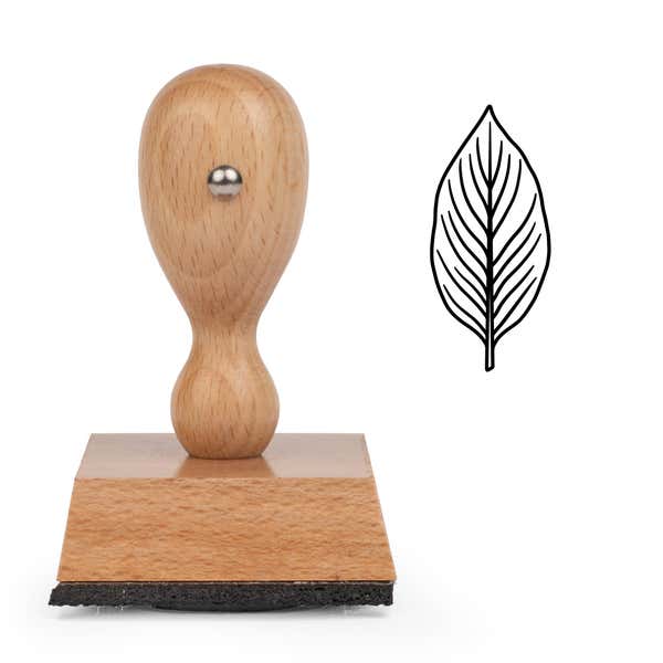 Oval Veined Leaf Craft Stamp standing upright beside its black stamped oval veined leaf image