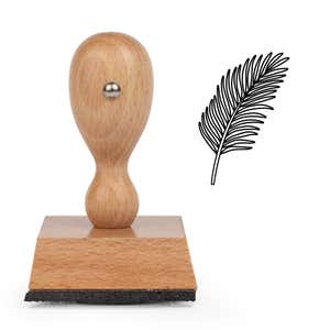 Feathered Frond Craft Stamp standing upright beside its black stamped feathered frond image