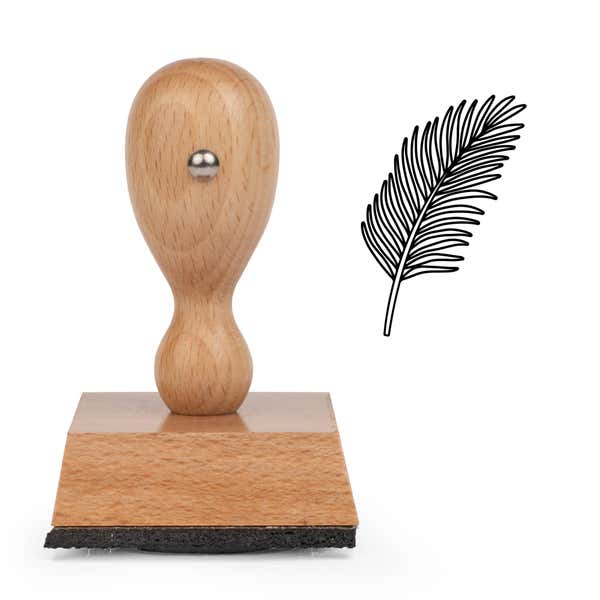 Feathered Frond Craft Stamp standing upright beside its black stamped feathered frond image