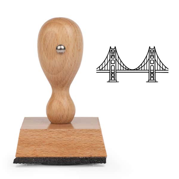 Golden Gate Bridge Craft Stamp standing upright beside its black stamped Golden Gate Bridge image