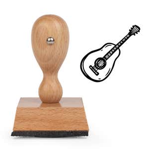 Guitar Craft Stamp standing upright beside its black stamped guitar image