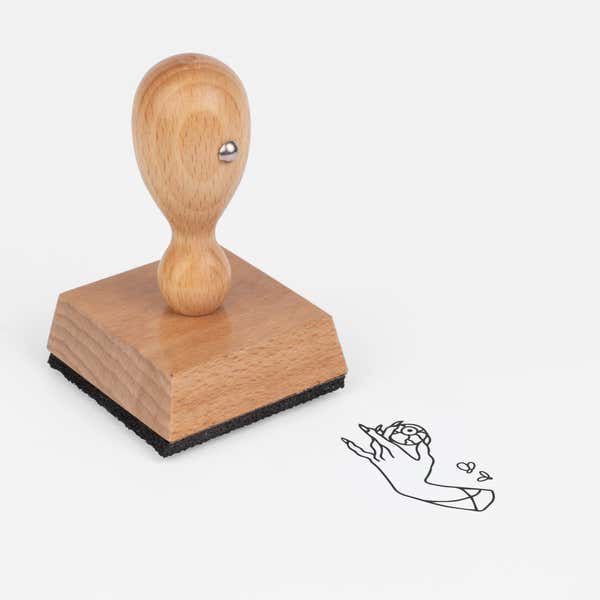 Eerie Hand Eye Craft Stamp at an angle with its wooden handle and block