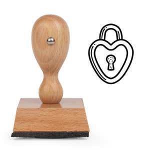 Forever Heart Lock Craft Stamp standing upright beside its black stamped heart lock image