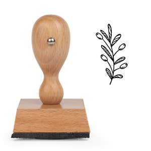 Cheerful Holiday Sprig Craft Stamp standing upright beside its black stamped cheerful holiday sprig image