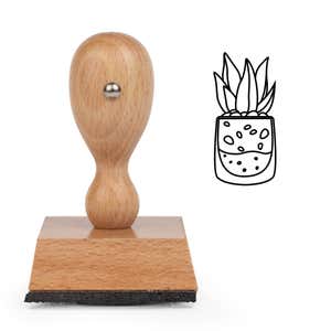 Pebble Jar Succulent Craft Stamp standing upright beside its black stamped pebble jar succulent image