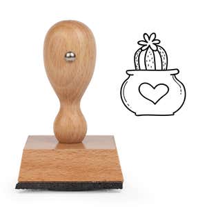 Heart Pot Cactus Craft Stamp standing upright beside its black stamped heart pot cactus image