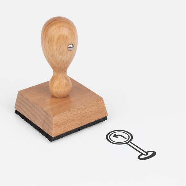 Left Turn Sign Craft Stamp at an angle with its wooden handle and block
