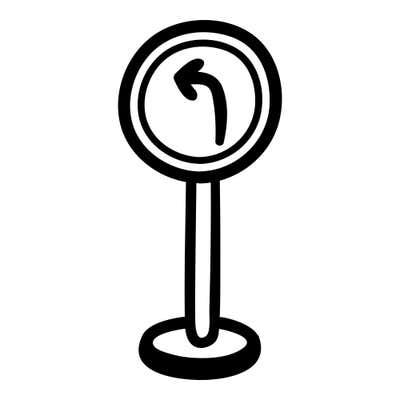 Road sign with a curved left-turn arrow, mounted on a single post with a weighted base