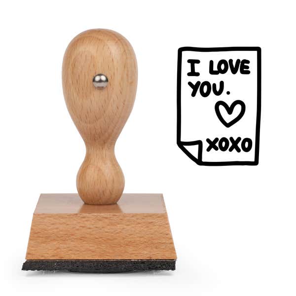 Secret Love Note Craft Stamp standing upright beside its black stamped love note image