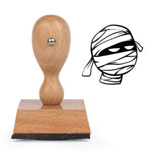 Bandaged Mummy Craft Stamp standing upright beside its black stamped mummy image