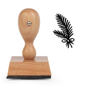 Woodland Pine Branch Craft Stamp standing upright beside its black stamped woodland pine branch image