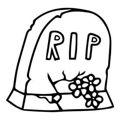 Weathered headstone with outlined RIP letters, a chipped top, a crack through the stone and base, and flowers at its foot