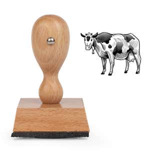 Sketched Cow Craft Stamp standing upright beside its black stamped sketched dairy cow image