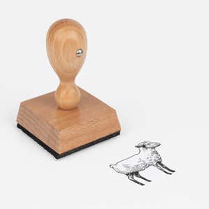 Sketched Sheep Craft Stamp at an angle with its wooden handle and block