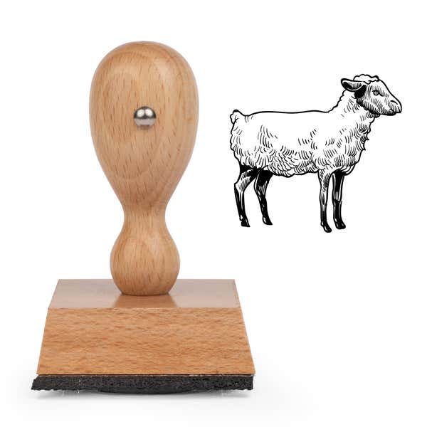 Sketched Sheep Craft Stamp standing upright beside its black stamped sketched sheep image