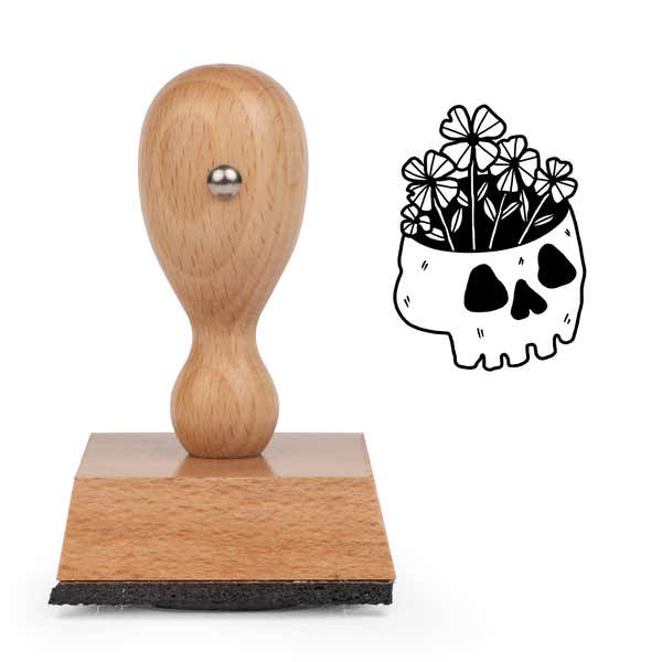 Gothic Skull Plant Craft Stamp standing upright beside its black stamped skull planter image