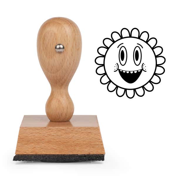 Grinning Retro Flower Craft Stamp standing upright beside its black stamped grinning retro flower image