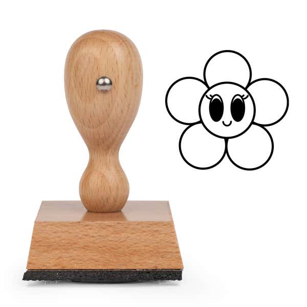 Wide-Eyed Flower Craft Stamp standing upright beside its black stamped wide-eyed flower image