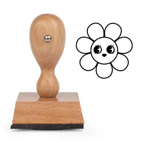 Sparkle-Eyed Flower Craft Stamp standing upright beside its black stamped sparkle-eyed flower image