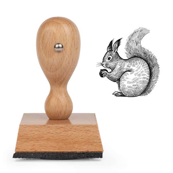 Woodland Squirrel Craft Stamp standing upright beside its black stamped engraved squirrel image