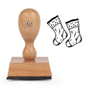 Mantel Christmas Stockings Craft Stamp standing upright beside its black stamped mantel Christmas stockings image