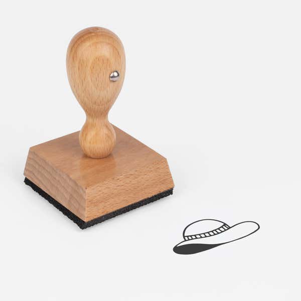 Sun Hat Craft Stamp at an angle with its wooden handle and block
