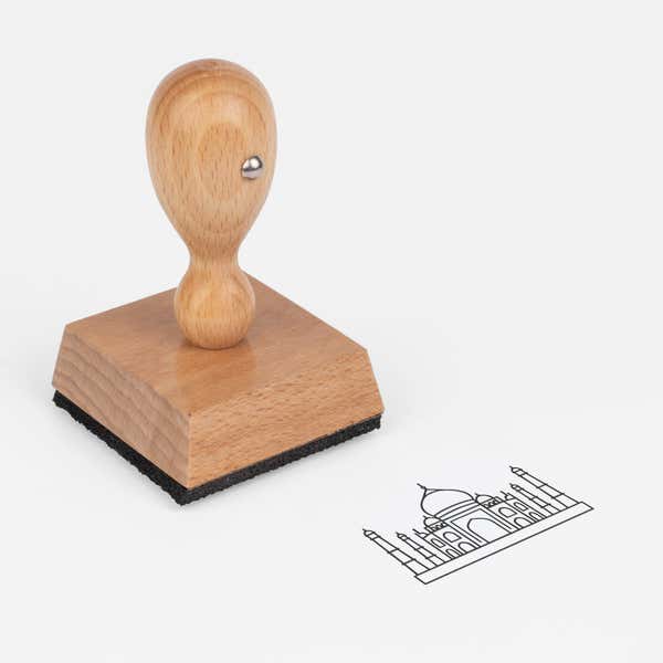 Taj Mahal Craft Stamp at an angle with its wooden handle and block