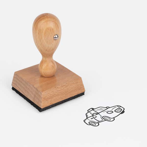 Taxi Craft Stamp at an angle with its wooden handle and block