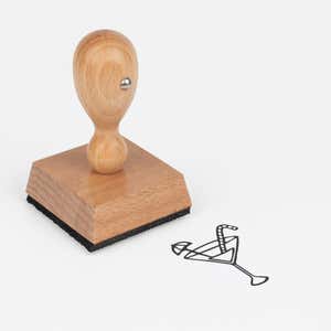 Tropical Drink Craft Stamp at an angle with its wooden handle and block