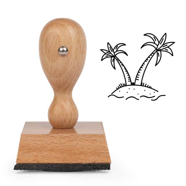 Tropical Island Craft Stamp standing upright beside its black stamped tropical island image