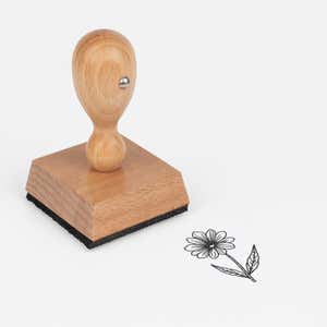 Fine-Line Daisy Stem Craft Stamp at an angle with its wooden handle and block